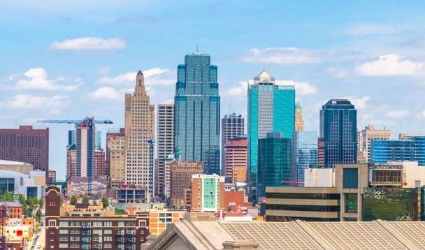 City skyline with modern buildings and blue sky.